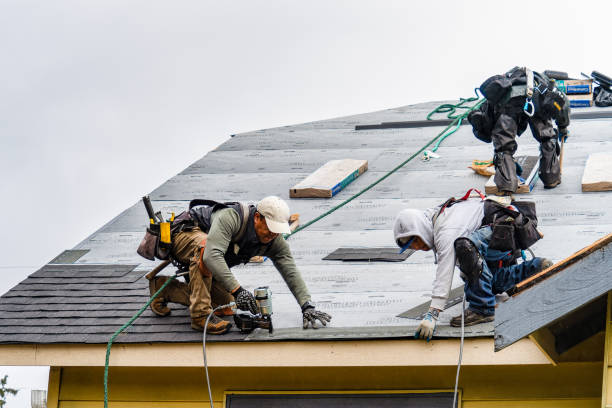Professional Roofing technician working in Manchester, NY